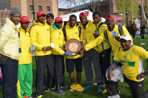  Team and coaches with shield and medals